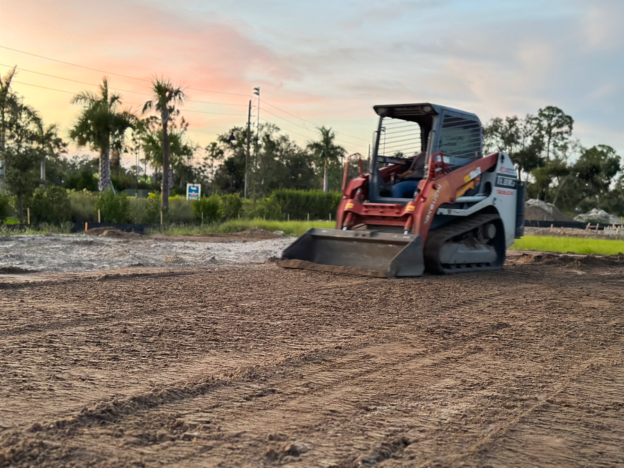 Skid loader leveling lot